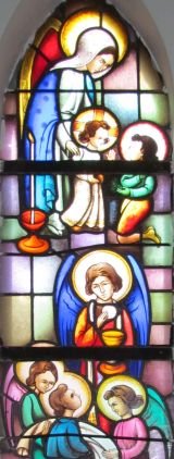 Jezuskind met broodje. Communie van de engel. St. Jozefkerk
